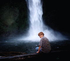 Carson by a waterfall